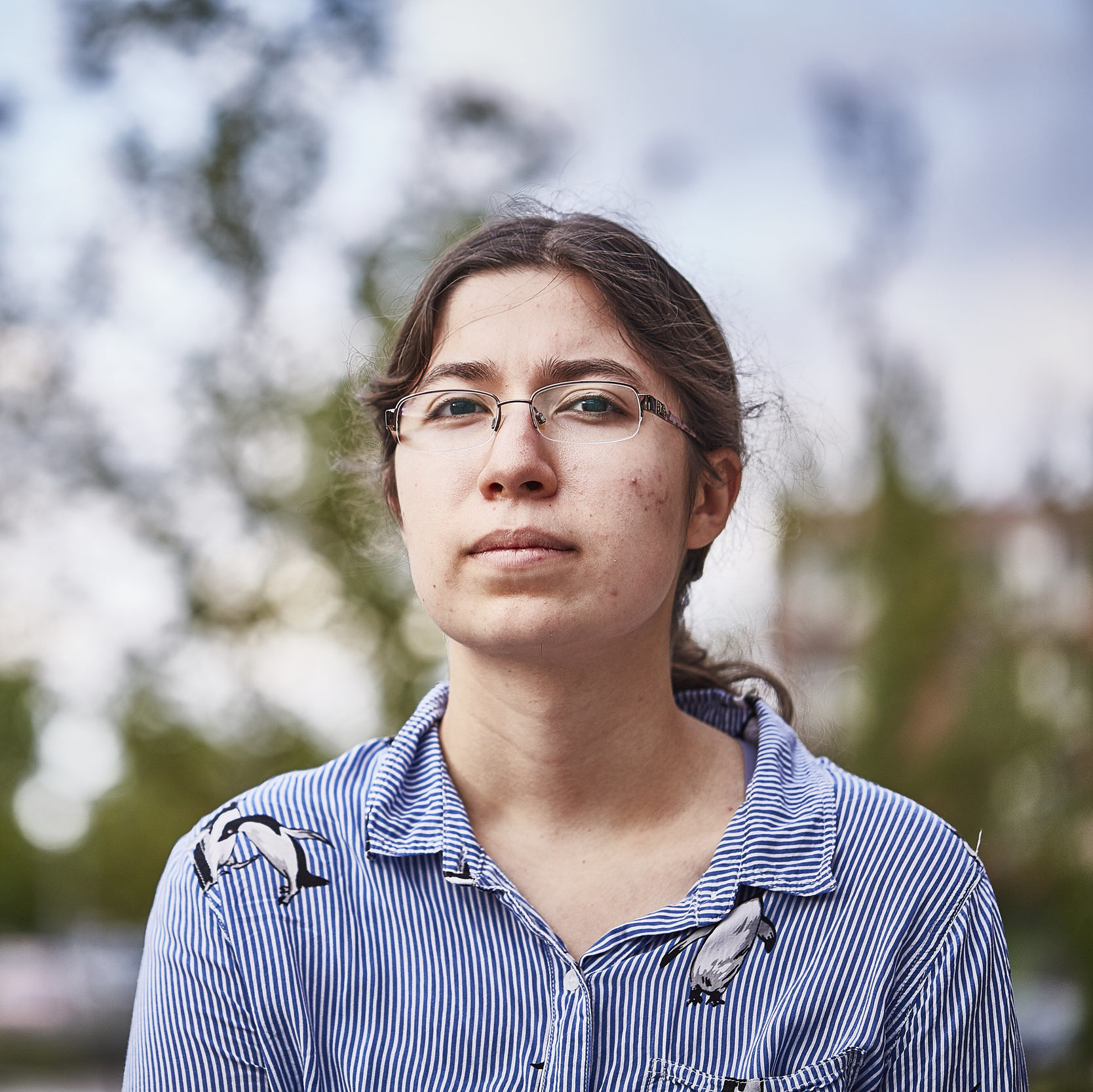 determined young white woman with glasses