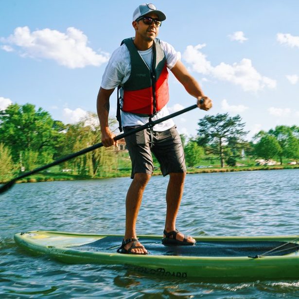 man on stand up paddle board