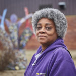 grey-haired black woman smiling confidently