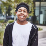 Smiling young Black man with headband