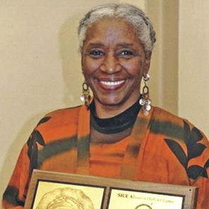 Smiling older black woman with short grey hair