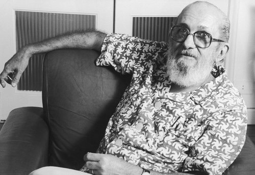 Paulo Freire lounging on chair