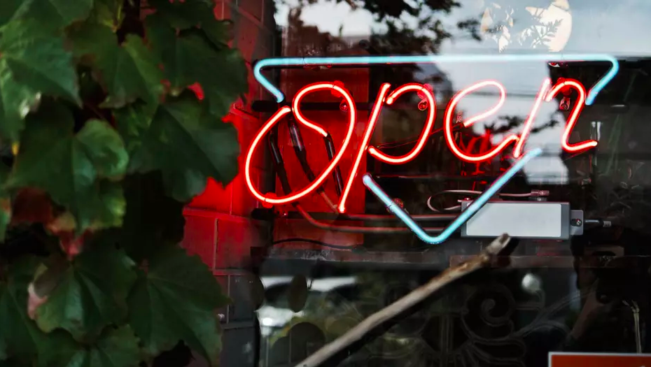 photo of neon sign business open