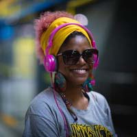 Black girl smiling with headphones on